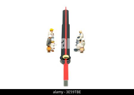 Miniature people toy figure photography. Group of worker take a break rest sitting and waiting above clockwise. Isolated on white background. Image ph Stock Photo