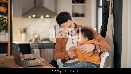 Father, infant and smile for remote work in home, family bonding and playing together for multitasking. Connection, freelancer and man with son in Stock Photo