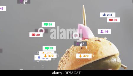 Displaying sesame bun in studio with olive, skewer topped by pink-pick, UI badges, copy space Stock Photo