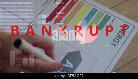 Marking energy rating sheet with hand holding black marker on wooden desk, BANKRUPT overlay Stock Photo