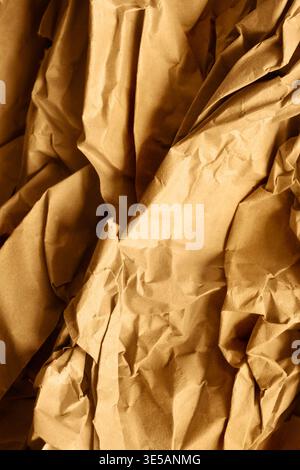 Crumpled brown wrapping paper closeup as a background Stock Photo