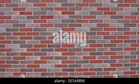 Beautiful grainy brick wall texture made of red, blue and gray blocks, graphic resource for background use with empty copy space on bright surface Stock Photo