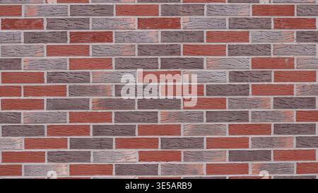 Brickwork made of multi-colored bricks with smooth seams and empty space on the textured surface, a wall of gray, red and brown bricks Stock Photo