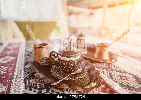 Traditional Turkish Coffee Setup on Ornate Tablecloth Stock Photo