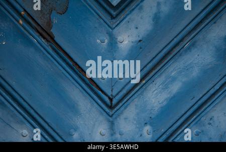 Close up of painted metal surface with diagonal geometric pattern and visible scratches. Stock Photo