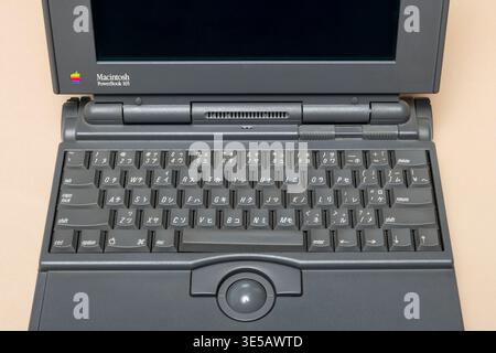 Pavia, Lombardy, Italy - November 02, 2024: Vintage Apple Macintosh PowerBook showing detail of its gray keyboard and trackball. Shown at Ctrl+Alt Mus Stock Photo