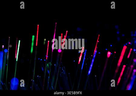 Colorful vertical light lines representing diverse connections, global communication, and modern business networks in a digital environment. Stock Photo