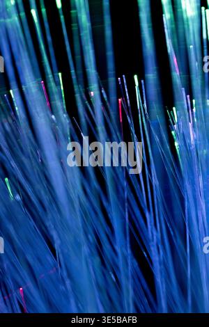 blue fiber optic strands with glowing tips, symbolizing high-speed internet, data transmission, and advanced communication technology. Stock Photo