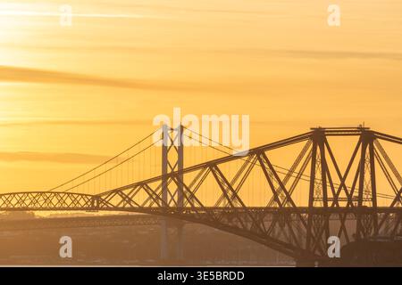 Beautiful orange colours of sunset at the Forth Bridge and the Forth Road Bridge, Scotland Stock Photo