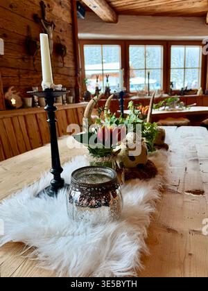 A beautifully decorated wooden dining table inside Stock Photo