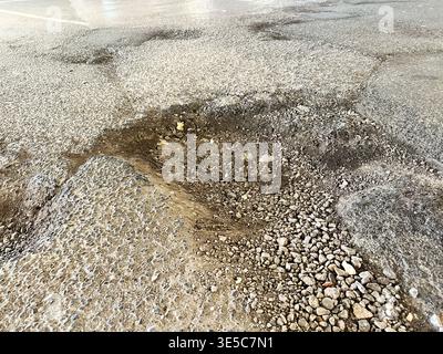 Pothole - Pot hole Stock Photo