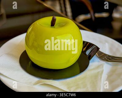 Photograph showcasing polished apple shaped sweet delicacies in studio setting. Highquality studio photograph featuring reflective apple themed Stock Photo