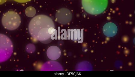 Glowing multicolor round bokeh lights drifting on dark maroon background, with golden glitter Stock Photo
