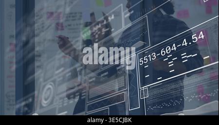 Pointing three staff wearing work clothes analyzing digital UI on office glass with sticky notes Stock Photo