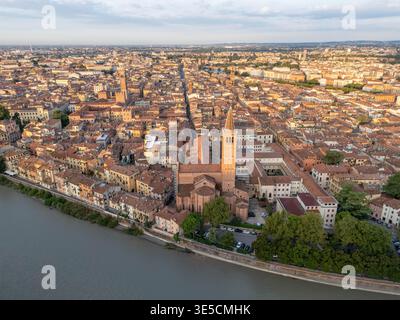 Aerial View Verona Italy at Sunrise with Historic Buildings and a Church with a Bell Tower Stock Photo
