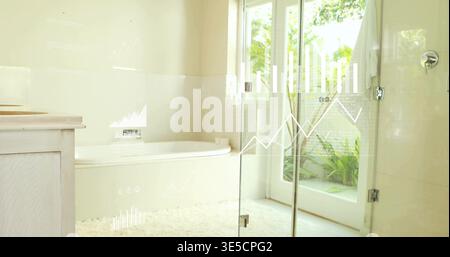 Showing built-in white alcove bathtub reflecting natural light in home bathroom, with planter Stock Photo