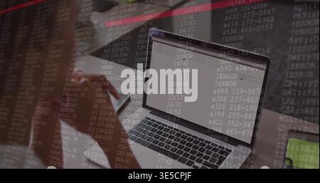 Showing laptop ERROR and code overlay on desk, green-screen tablet, blurred woman in dark sweater Stock Photo