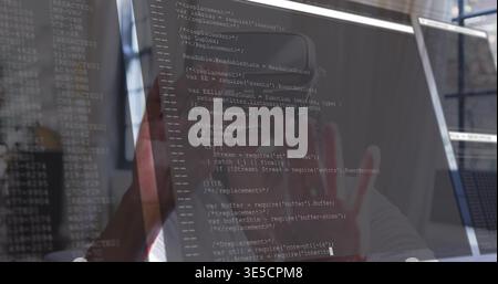 Examining senior woman reading code on work monitor with glossy screen and terminal wearing top Stock Photo