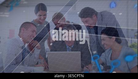 Leaning team wearing suits, blazers, collaborating around laptop at conference table showing HUD Stock Photo