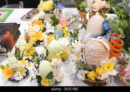 Easter products for sale on a shop counter, featuring wreaths, decorative bunnies, and colorful eggs horizontal photo Stock Photo
