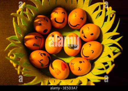 Painted Easter eggs with emoji faces. Stock Photo