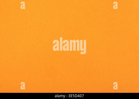 Bright orange textured paper background, ideal for creative designs, crafts, invitations, and digital presentations. Stock Photo
