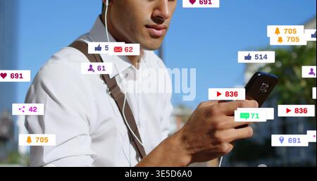 Checking adult male in white button shirt scrolling phone on street with earphones, notifications Stock Photo