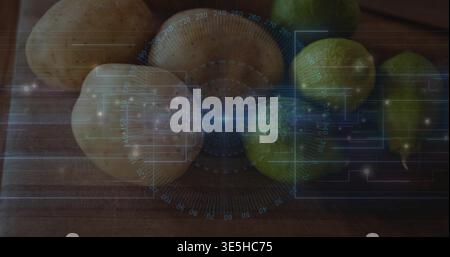 Displaying cluster of pale rounds and green pears resting on wooden cutting board, with HUD gauge Stock Photo