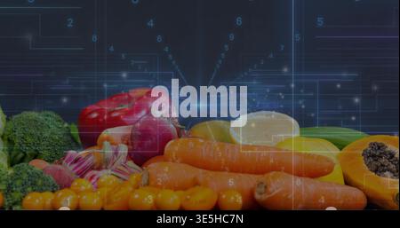 Displaying fresh produce on dark reflective surface at studio, showing carrots, papaya, HUD overlay Stock Photo