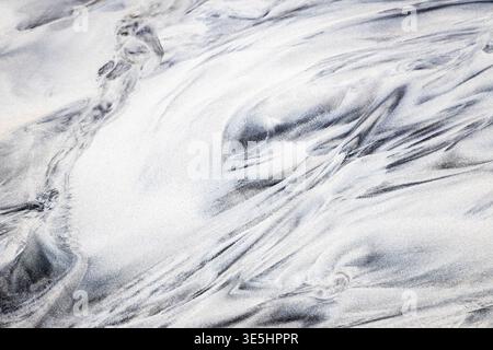 View of shapes like a painting on the sands of the beach of Skagsanden in winter. Skagsanden beach, Flakstad, Lofoten Islands, Norway, Europe. Stock Photo
