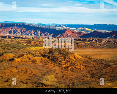 Aerial view of rugged rock formations and desert landscape with sparse ...