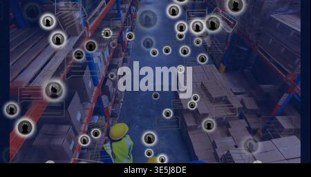 Inspecting workers in yellow helmets and vests checking pallet racks in depot, with digital overlay Stock Photo
