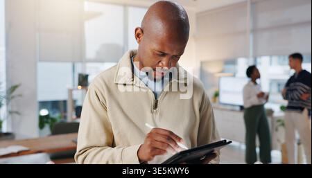 Tablet, pen and businessman in office with research for software development with programming. Digital technology, stylus and male web developer with Stock Photo