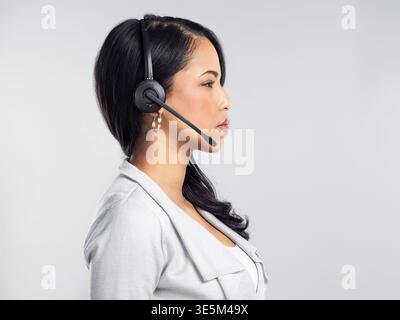 Think, call center or woman in studio for customer service, support or profile for feedback. Problem solving, headset and help desk consultant with Stock Photo