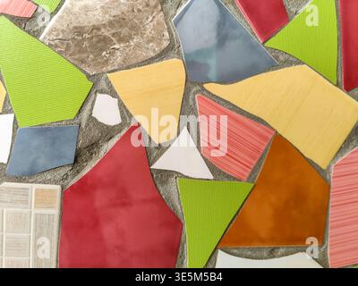 Vibrant Mosaic Artwork Displaying Assemblage of Colored Tiles. Array of brightly colored and textured tiles arranged in captivating mosaic pattern. Fu Stock Photo