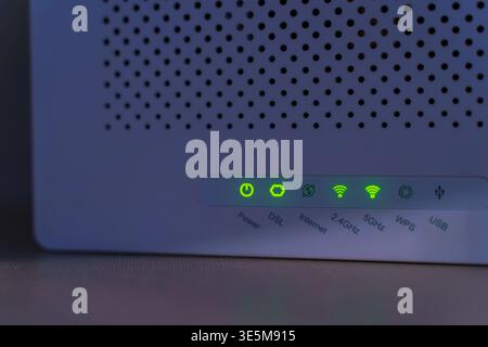 WiFi Router with Green LED Indicators Showing Active Connection. High quality photo Stock Photo