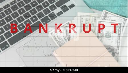 Displaying red BANKRUPT covering work desk showing laptop keys trackpad, cash, pink notebook, chart Stock Photo