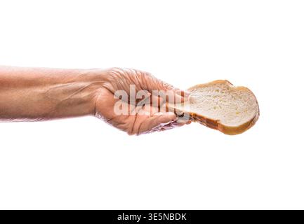Hands bread slice. A slice of bread in hand, isolated against a white background. Holding a small piece of bread in a human hand, isolated on white Stock Photo