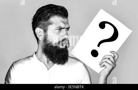Confused male thinking with question mark. Scream man with question mark. Doubtful man asking questions to himself. Black and white Stock Photo