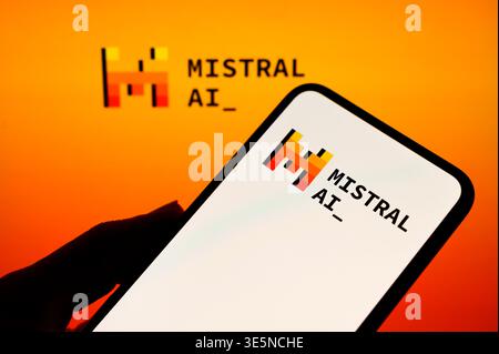 Paris, France. 1st April, 2026. Mistral AI logo shown on both a smartphone screen and a background display, highlighting the brand's presence. Stock Photo