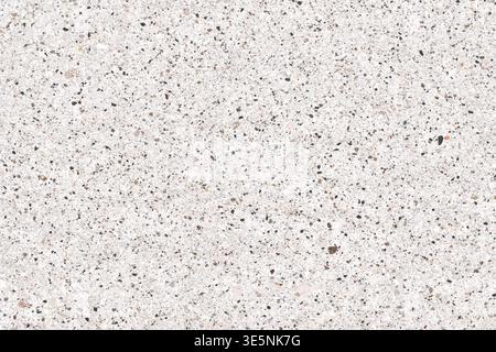 High-resolution of a white terrazzo or quartz surface with multi-colored stone chips and small pebbles. Ideal for architectural and interior design backgrounds. Stock Photo