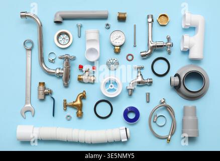 Composition with plumber's items on blue background Stock Photo