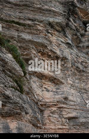 Natural rock texture with layered stone surface and earthy tones, abstract geological background Stock Photo