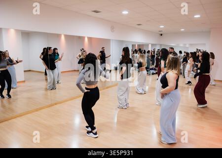 Dance class rehearsing choreography in a professional studio Stock Photo