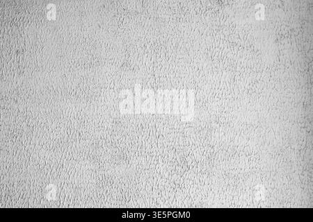 Grey textured concrete wall background with rough plaster surface and fine grain. Stock Photo