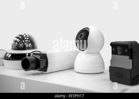 Modern IP CCTV security cameras on white background. Stock Photo