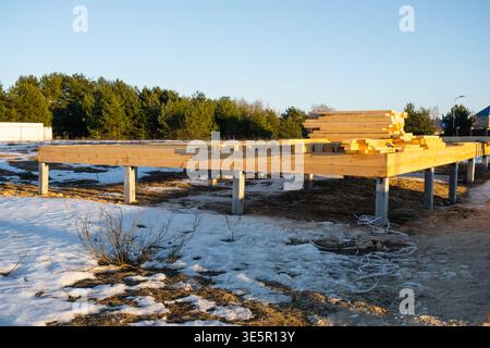 Wood frame house, skeletal mounting, assembly in progress, support ...