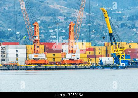 Batumi, Georgia - March 31, 2026: Reach stacker operating among stacked ...