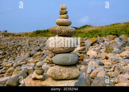 Stacked stones balanced on the pebble beach Stock Photo