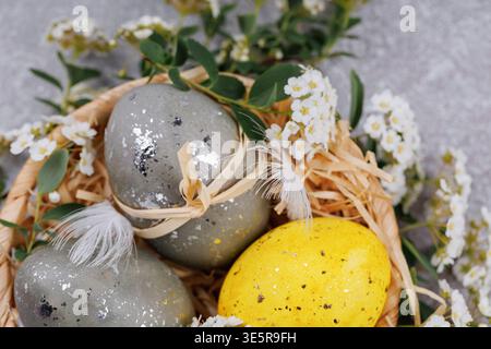 Easter eggs spring decoration in rustic basket Stock Photo